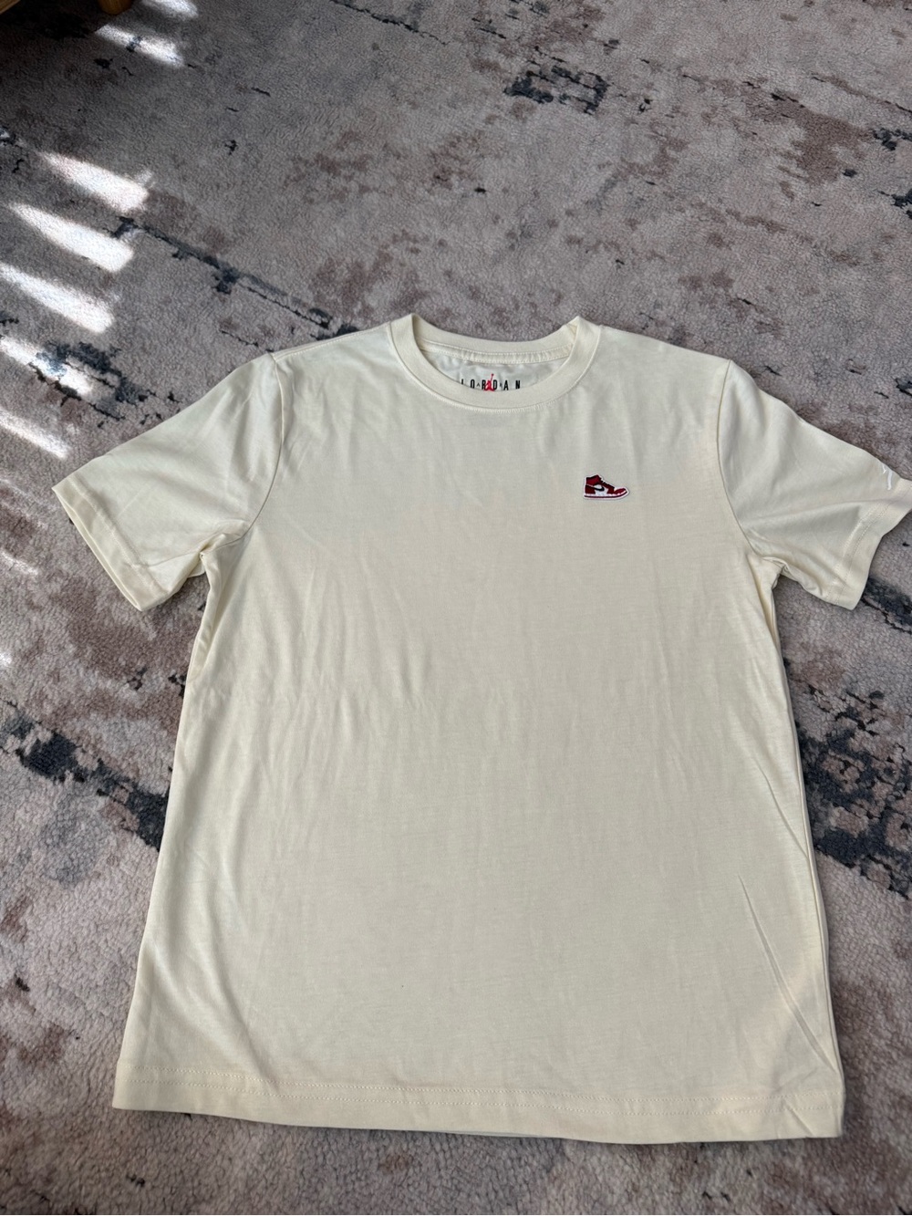 Jordan Light Yellow Short Sleeve Tee with Small Red/Black Sneaker Logo